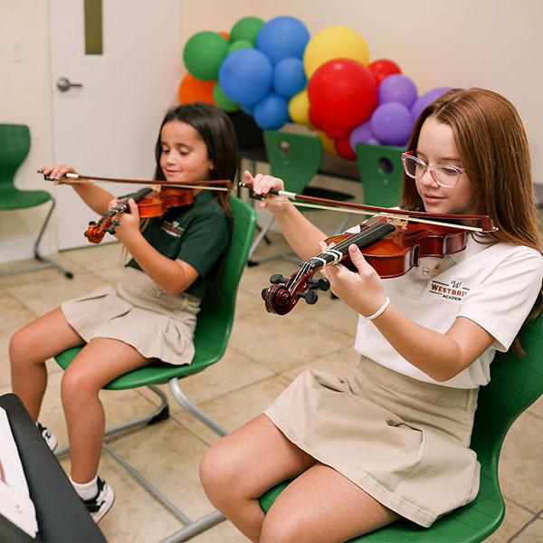 students playing violins